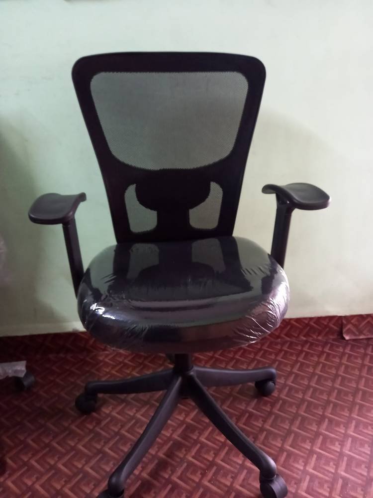 Office chairs in a real workplace setting